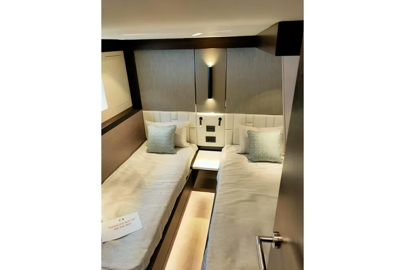 Elixa Yacht Photos Pics Luxurious twin cabin interior of 2022 Sunseeker Manhattan 68 yacht, featuring modern design.