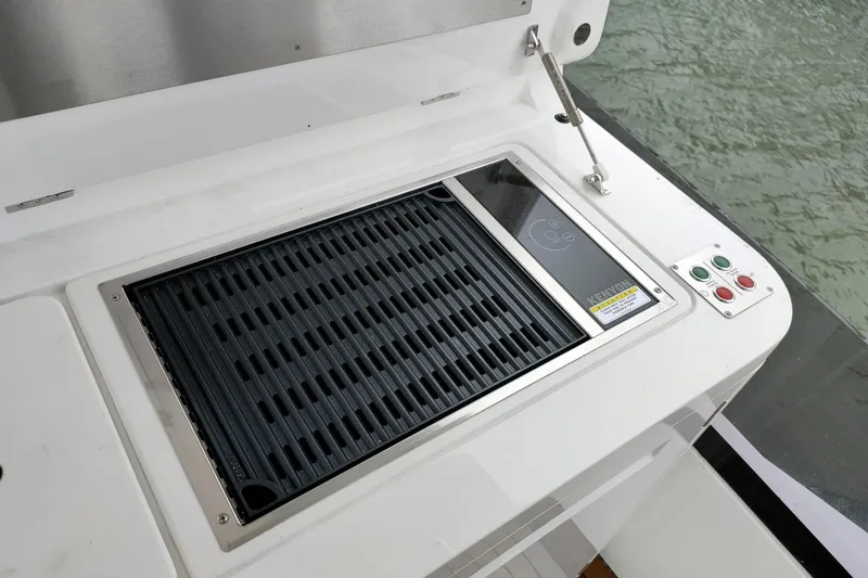 Elixa Yacht Photos Pics Outdoor grill on 2022 Sunseeker Manhattan 68 yacht, featuring sleek design and modern controls.