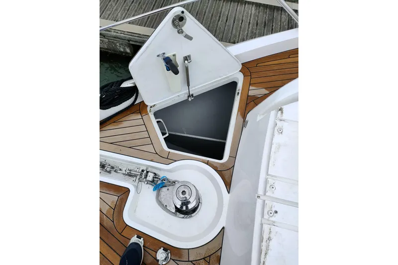 Elixa Yacht Photos Pics 2022 Sunseeker Manhattan 68 yacht deck with open storage compartment and winch.