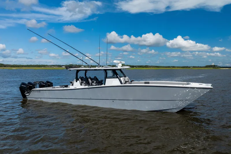  Yacht Photos Pics 2023 Freeman 47 boat on calm water under a clear blue sky.