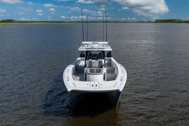  Yacht Photos Pics 2023 Freeman 47 boat on calm water under a blue sky.
