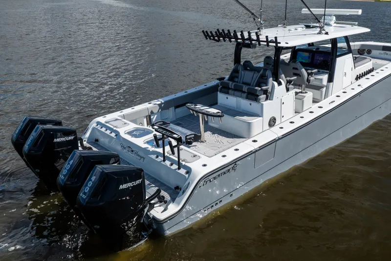  Yacht Photos Pics 2023 Freeman 47 boat with Mercury engines on calm water.