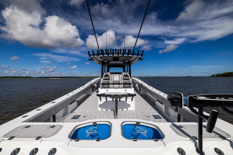  Yacht Photos Pics 2023 Freeman 47 boat on open water under blue sky with clouds.