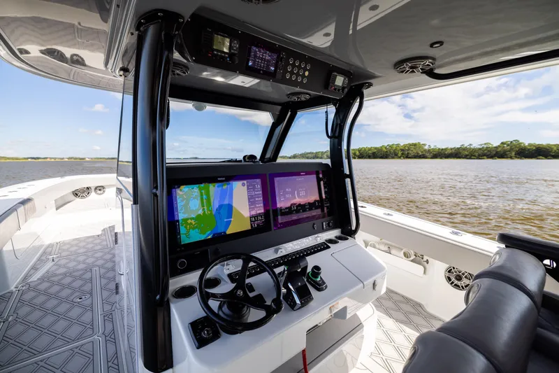  Yacht Photos Pics Interior view of 2023 Freeman 47 boat cockpit with advanced navigation system.
