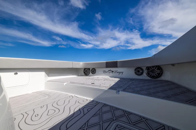  Yacht Photos Pics 2023 Freeman 47 boat interior with speakers, under a clear blue sky.