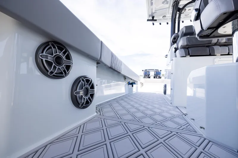  Yacht Photos Pics 2023 Freeman 47 boat interior with speakers and cushioned seating.