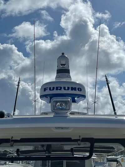  Yacht Photos Pics Boston Whaler 350 Realm 2021 with Furuno radar against cloudy sky.