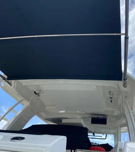  Yacht Photos Pics 2021 Boston Whaler 350 Realm boat with canopy, viewed from below.
