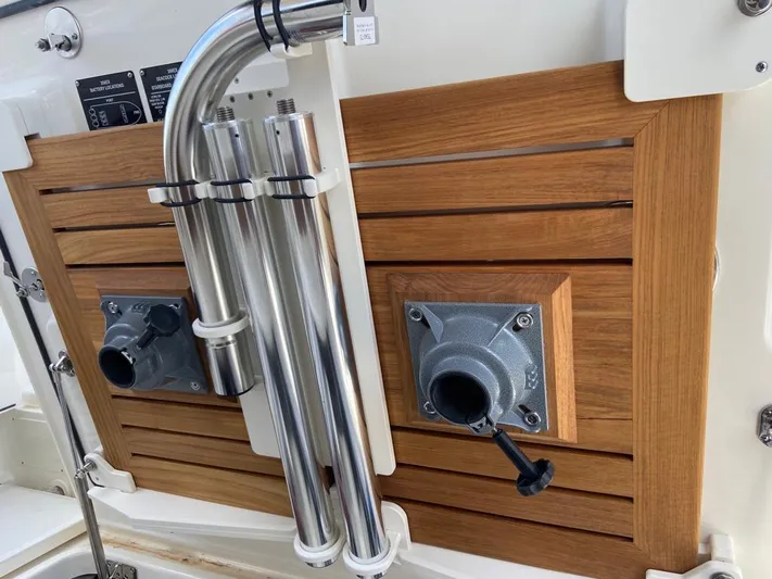  Yacht Photos Pics Boston Whaler 350 Realm 2021 boat detail with wooden panel and metal fixtures.