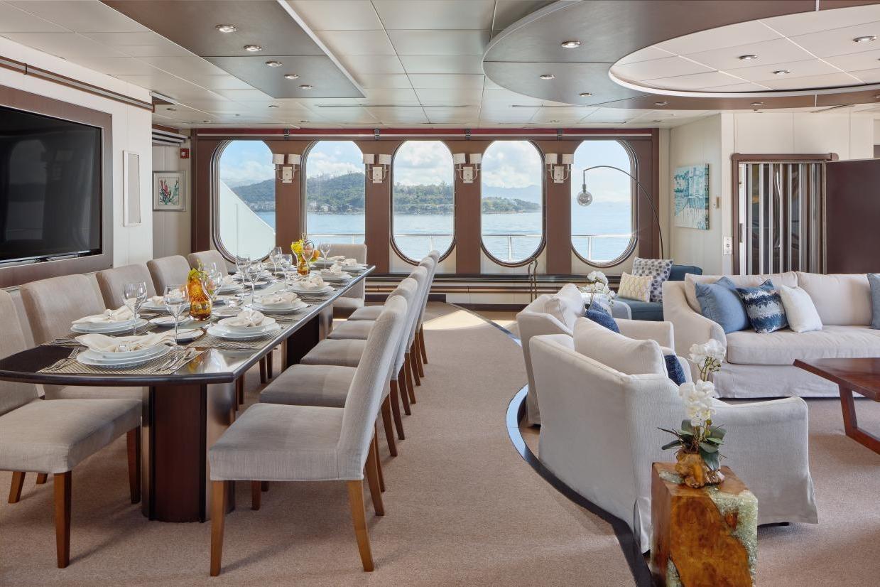 Luxurious interior of 1982 Shadow Marine Custom Expedition Yacht with elegant dining and seating areas.