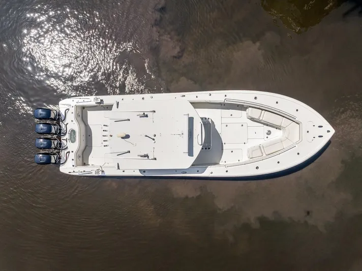  Yacht Photos Pics Aerial view of 2015 Yellowfin 39 boat with triple engines on calm water.