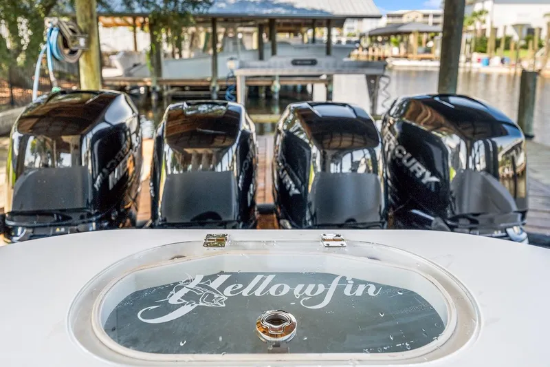  Yacht Photos Pics 2015 Yellowfin 39 boat with four Mercury outboard engines at a dock.