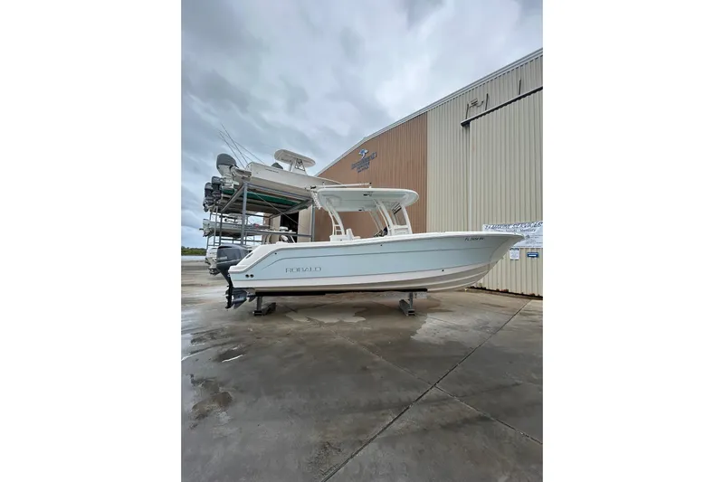 302-176 Brokerage Anthony Yacht Photos Pics 2018 Robalo R302 Center Console boat on display outside a storage facility.