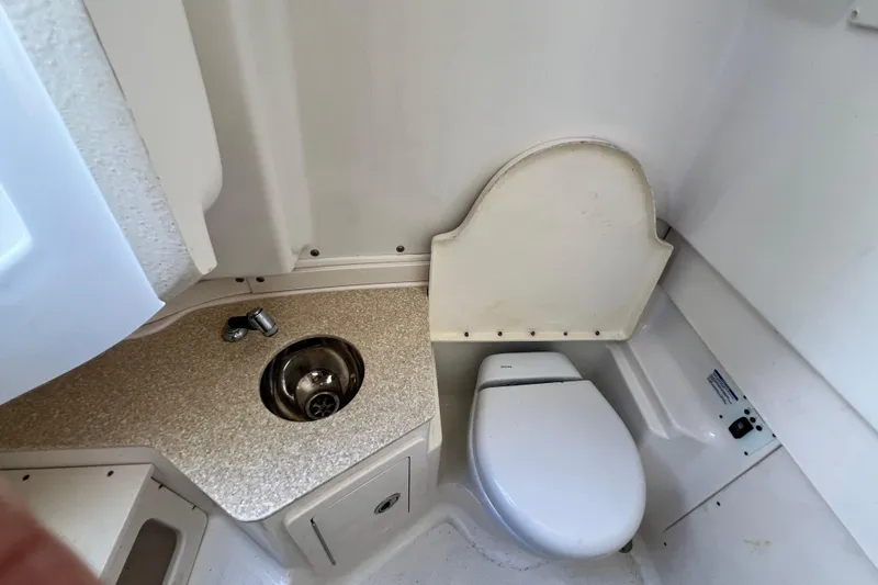 302-176 Brokerage Anthony Yacht Photos Pics 2018 Robalo R302 Center Console boat bathroom with sink and toilet.