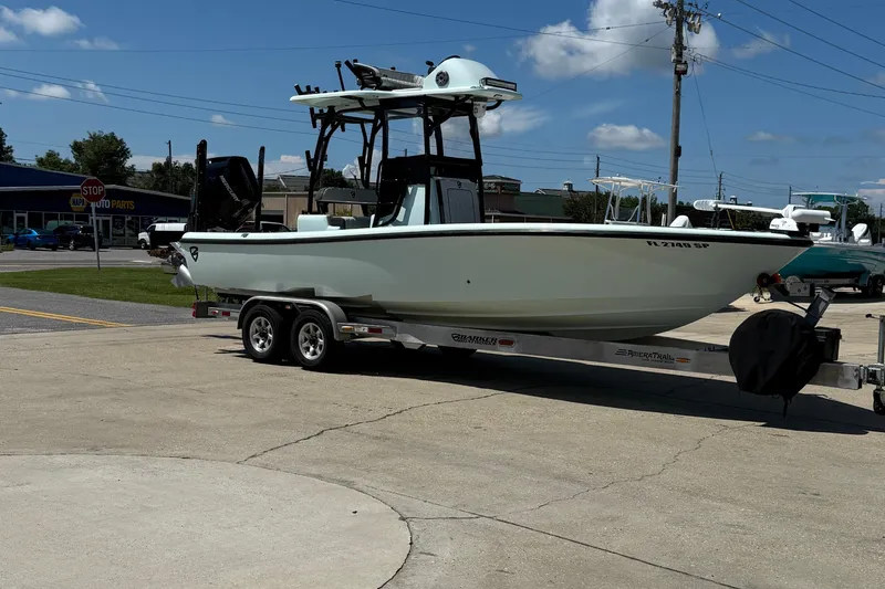 Island Time Yacht Photos Pics 2020 BARKER 26 boat on trailer in parking lot, sunny day, clear sky.
