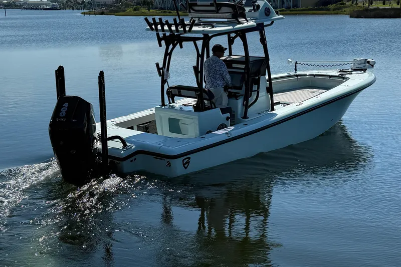 Island Time Yacht Photos Pics 2020 BARKER 26 boat cruising on calm water with a person at the helm.