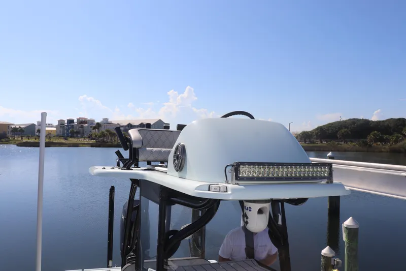 Island Time Yacht Photos Pics BARKER 26 boat (2020) with light bar on calm water, clear sky background.