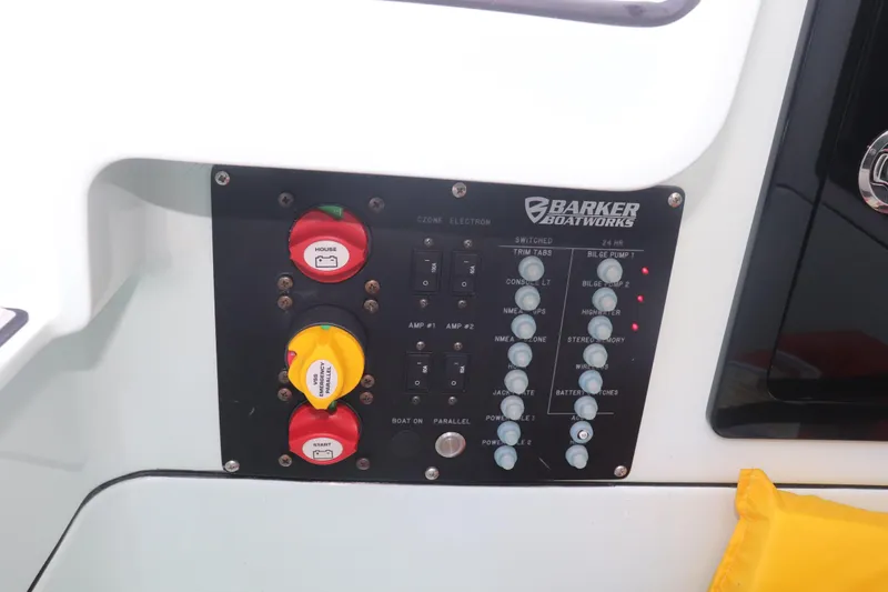 Island Time Yacht Photos Pics Control panel of a 2020 Barker 26 boat with switches and emergency power controls.