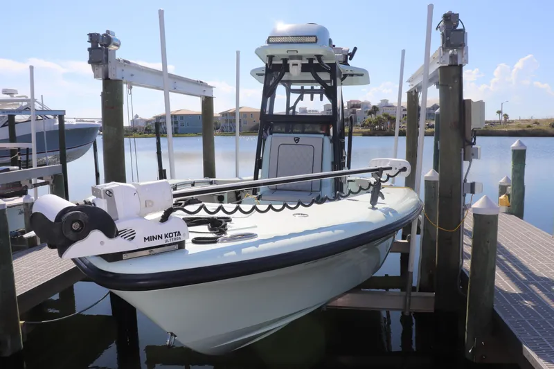 Island Time Yacht Photos Pics 2020 BARKER 26 boat with Minn Kota Ulterra motor on a lift at a marina.