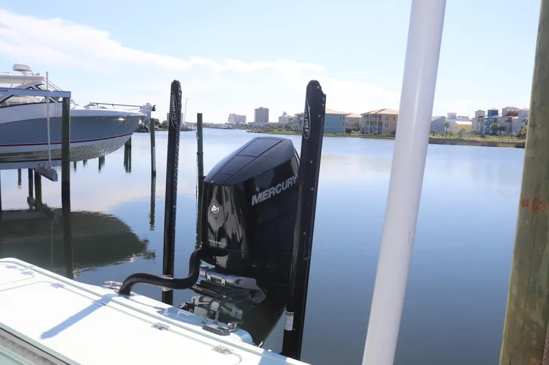 Island Time Yacht Photos Pics 2020 BARKER 26 boat with Mercury engine docked by calm waters.