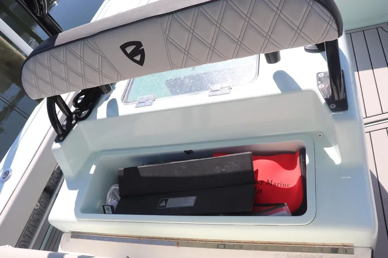 Island Time Yacht Photos Pics Open storage compartment on a 2020 BARKER 26 boat with marine equipment inside.