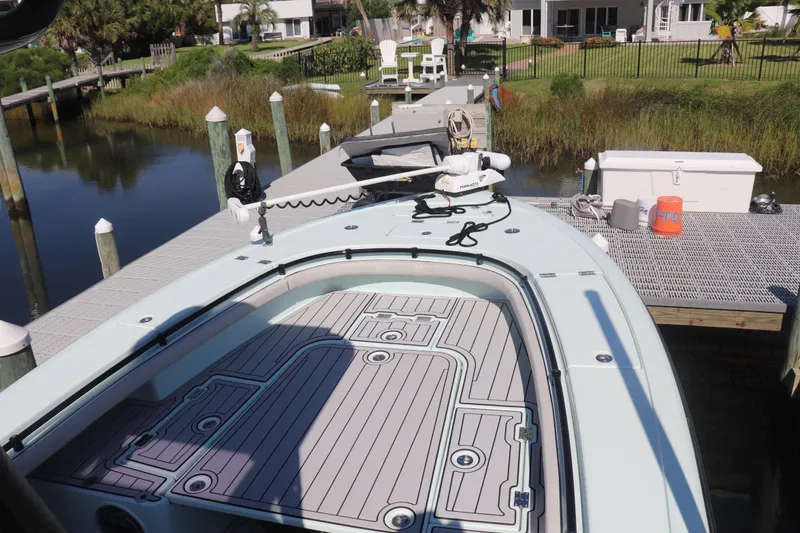 Island Time Yacht Photos Pics 2020 BARKER 26 boat docked, featuring a spacious deck and modern equipment.