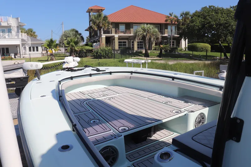 Island Time Yacht Photos Pics BARKER 26 boat, 2020 model, docked near waterfront homes with palm trees.