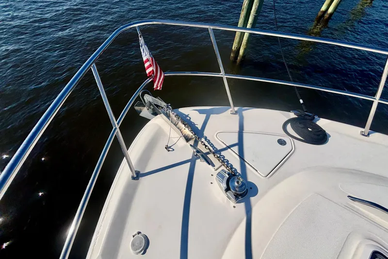  Yacht Photos Pics Bow of 2003 Sea Ray 480 Sedan Bridge with anchor and American flag.