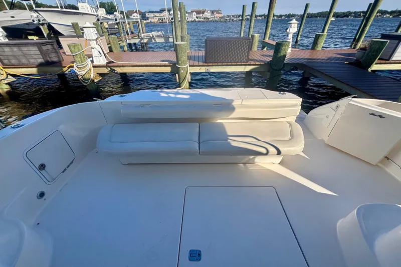  Yacht Photos Pics 2003 Sea Ray 480 Sedan Bridge yacht with spacious deck and seating at marina.