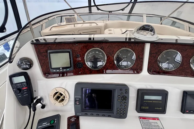  Yacht Photos Pics Control panel of a 2003 Sea Ray 480 Sedan Bridge with navigation and communication equipment.