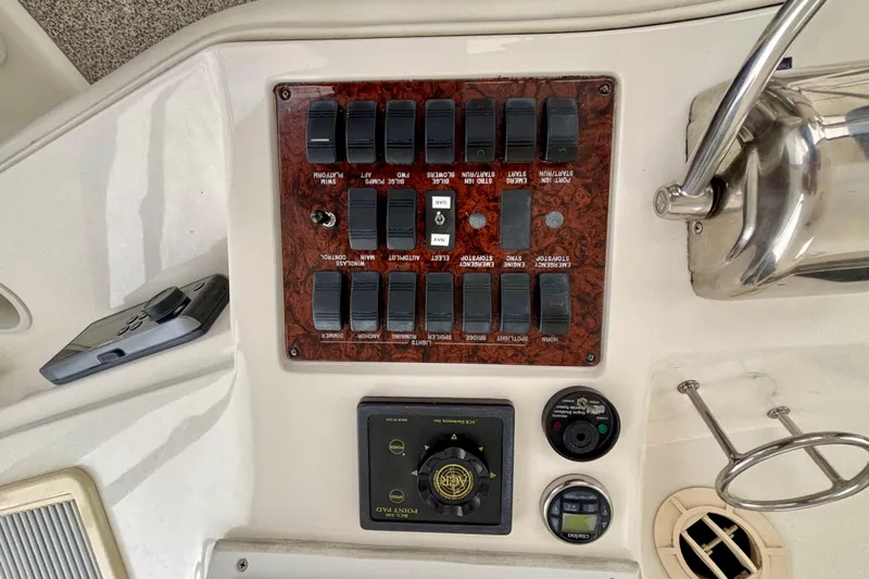  Yacht Photos Pics Control panel of a 2003 Sea Ray 480 Sedan Bridge yacht with switches and gauges.