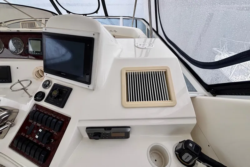  Yacht Photos Pics 2003 Sea Ray 480 Sedan Bridge helm with navigation controls and display screen.