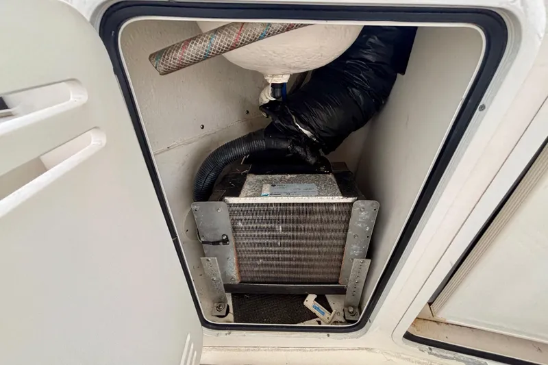  Yacht Photos Pics 2003 Sea Ray 480 Sedan Bridge engine compartment with visible components and hoses.