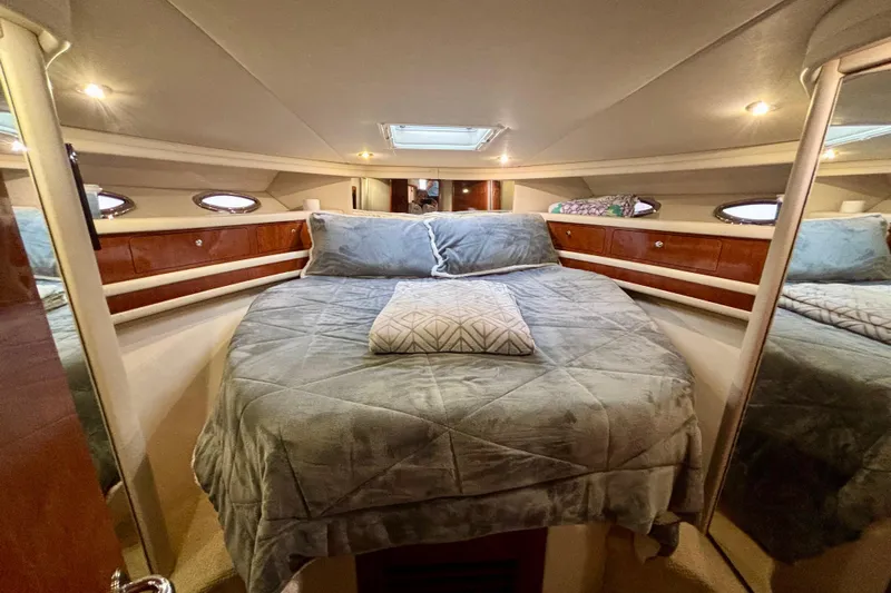  Yacht Photos Pics Luxurious bedroom interior of 2003 Sea Ray 480 Sedan Bridge yacht with cozy bedding.