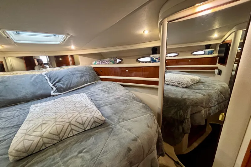  Yacht Photos Pics Luxurious bedroom interior of 2003 Sea Ray 480 Sedan Bridge yacht with plush bedding.