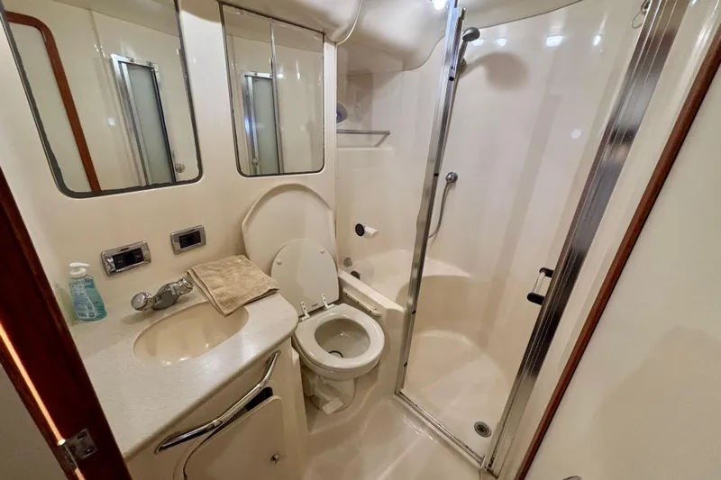  Yacht Photos Pics Luxurious bathroom in 2003 Sea Ray 480 Sedan Bridge yacht with shower and vanity.