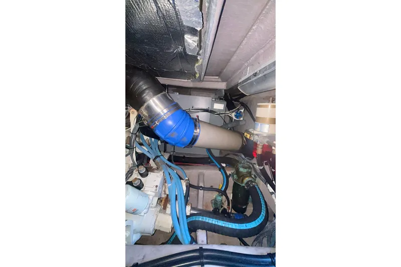  Yacht Photos Pics Engine room of 2003 Sea Ray 480 Sedan Bridge with visible hoses and components.