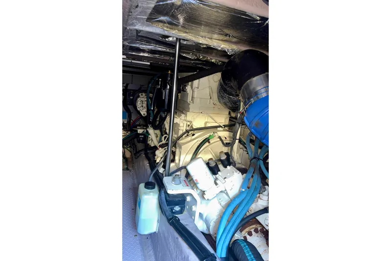  Yacht Photos Pics Engine room of 2003 Sea Ray 480 Sedan Bridge, showcasing mechanical components and wiring.