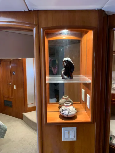Ocean Life Yacht Photos Pics Display shelf with sculptures inside a 2000 Carver 530 Voyager Pilothouse yacht interior.