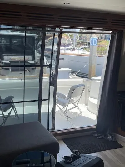 Ocean Life Yacht Photos Pics Interior view of 2000 Carver 530 Voyager Pilothouse with open sliding door to deck.