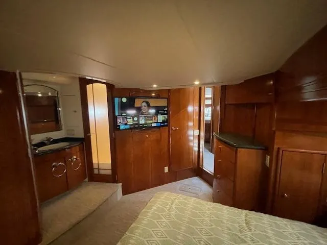 Ocean Life Yacht Photos Pics Luxurious interior of 2000 Carver 530 Voyager Pilothouse with wood paneling and modern amenities.