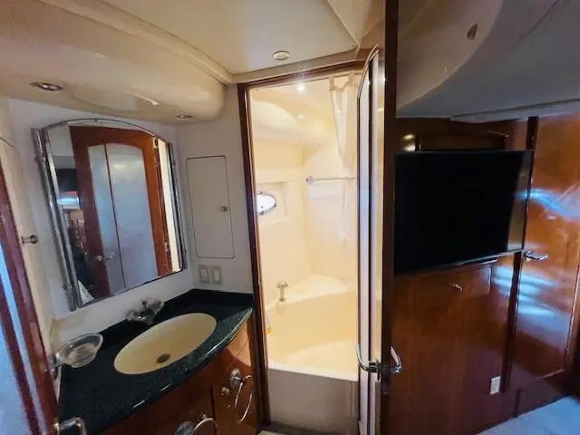 Ocean Life Yacht Photos Pics Luxurious bathroom in 2000 Carver 530 Voyager Pilothouse yacht with modern amenities.