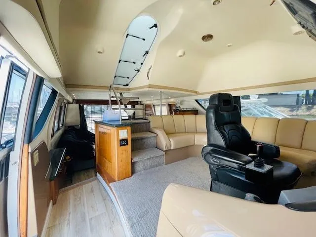 Ocean Life Yacht Photos Pics Luxurious interior of a 2000 Carver 530 Voyager Pilothouse yacht with plush seating and modern design.