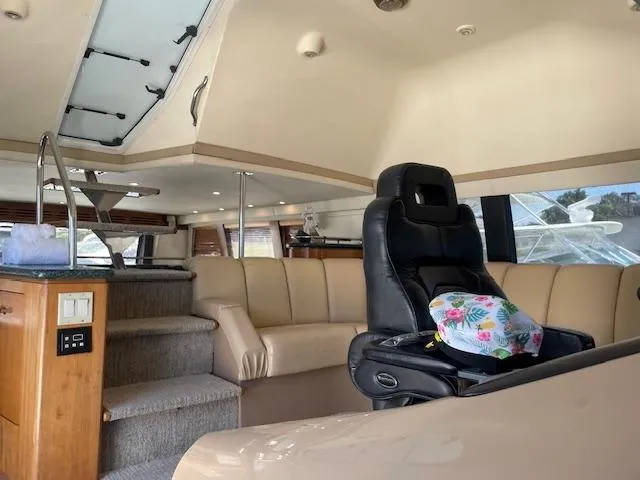 Ocean Life Yacht Photos Pics Interior of 2000 Carver 530 Voyager Pilothouse with leather seating and helm chair.