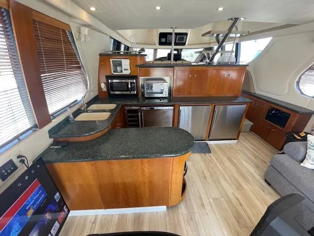 Ocean Life Yacht Photos Pics Luxurious kitchen interior of 2000 Carver 530 Voyager Pilothouse yacht with modern appliances.