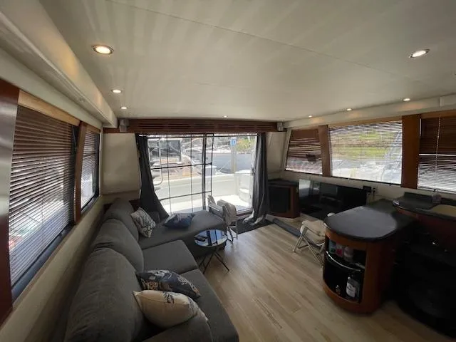 Ocean Life Yacht Photos Pics Luxurious interior of 2000 Carver 530 Voyager Pilothouse with modern furnishings and ample natural light.