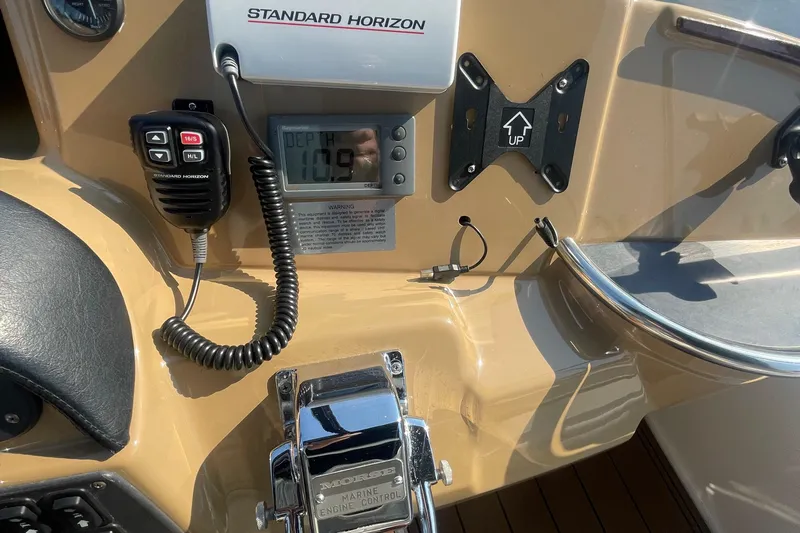  Yacht Photos Pics Control panel of a 2002 Carver 346 Aft Cabin with marine radio and depth gauge.