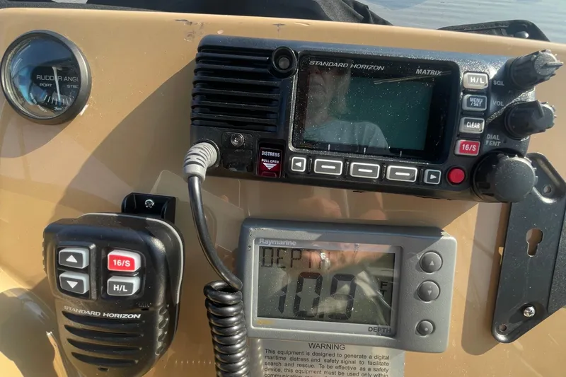  Yacht Photos Pics Control panel of a 2002 Carver 346 Aft Cabin with radio and depth gauge.