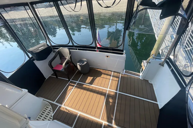  Yacht Photos Pics 2002 Carver 346 Aft Cabin boat interior with seating and water view.