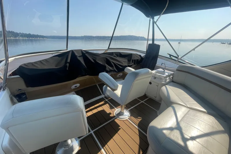  Yacht Photos Pics 2002 Carver 346 Aft Cabin yacht interior with seating, overlooking calm waters.